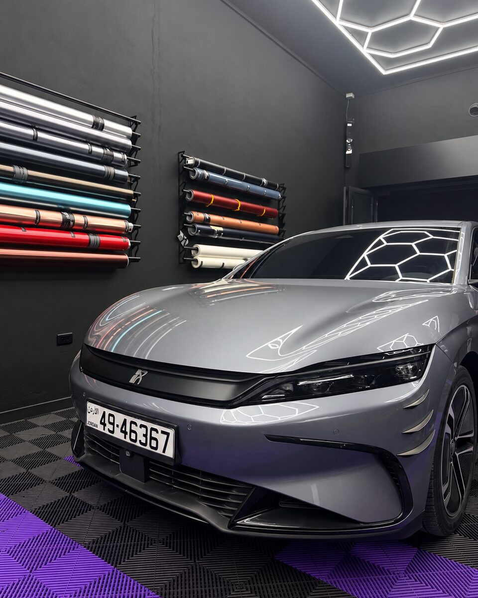 Front view of a BYD Han with a full super matte black dechrome inside the Los Santos studio